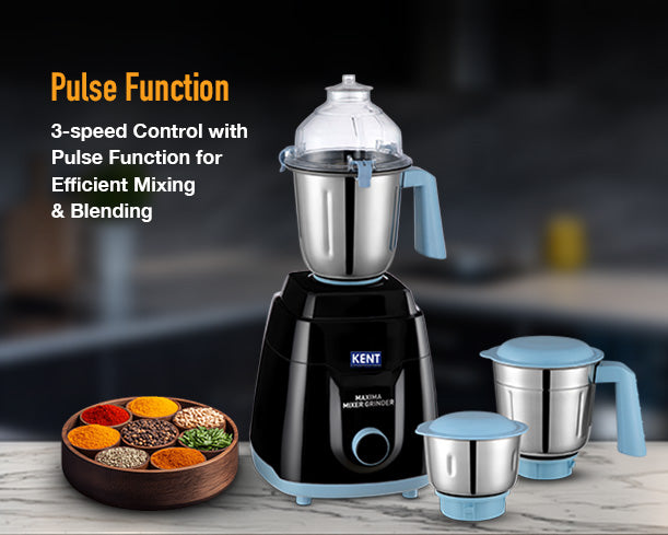 Kent Maxima Mixer Grinder with multiple jars and stainless steel blades, shown on a countertop in a modern kitchen.